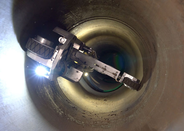 CISBOT repairing a cast iron pipe